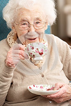 Senior Woman Enjoying Cup Of Tea At Home