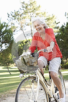 Senior Woman Enjoying Cycle Ride