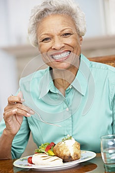 Senior Woman Enjoying A Meal At Home
