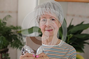 Senior woman enjoying some chocolate