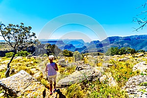 Senior woman enjoying the view of the highveld and the Blyde River Dam in the Blyde River Canyon Reserve