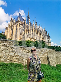 Senior woman on excursion in St Barbara Church Kutna Hora, Czech