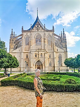 Senior woman on excursion in St Barbara Church Kutna Hora, Czech