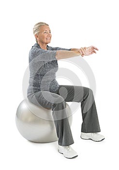 Senior Woman Exercising On Fitness Ball
