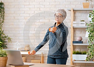 Senior woman exercising at home