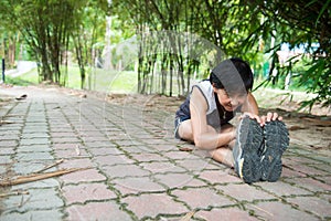 Senior woman exercising in park