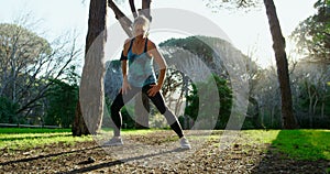 Senior woman exercising in the park 4k