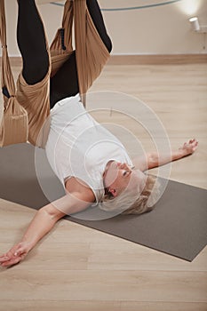 Senior woman exercising at sport studio