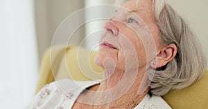 Senior woman, face and thinking on sofa at home to remember sad memory and relax in retirement. Serious elderly person