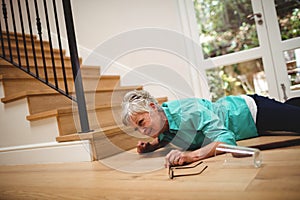 Senior woman fallen down from stairs photo