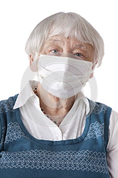 Senior woman with flu mask