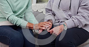 Senior woman, friends and holding hands in care, support or trust together in retirement or old age home. Closeup of