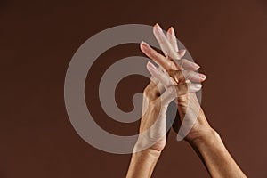 Senior woman gesturing while showing her hands on camera