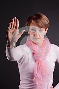 Senior woman gesturing stop