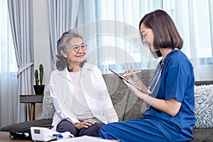 Senior woman get medical service visit from caregiver nurse at home while having result of medical exam for health care and