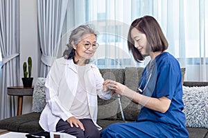 Senior woman get medical service visit from caregiver nurse at home while having result of medical exam from pulse oximeter for