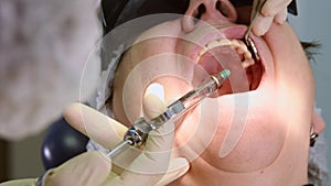 Senior woman getting dental implant