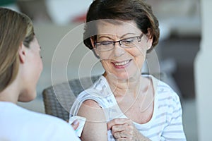 Senior woman getting a vaccination