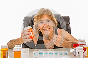 Senior Woman Gives Thumbs Up To Medication She Takes