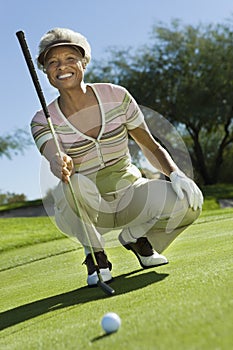 Senior Woman On Golf Course