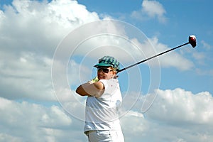 Senior woman golf swing