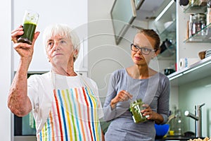 Senior woman grandmother cooking in a modern kitchen