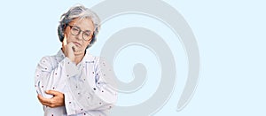 Senior woman with gray hair wearing casual business clothes and glasses thinking looking tired and bored with depression problems