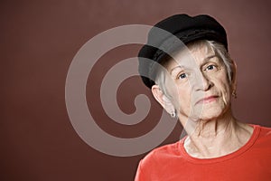 Senior woman in a Greek fishing hat