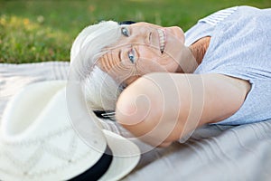 senior woman on green grass