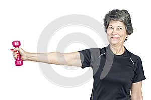 Senior woman in a gym class doing Pilates exercise lift weights