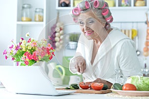 Portrait of senior woman in hair rollers