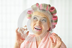 Senior woman in hair rollers