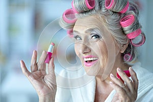 Senior woman in hair rollers
