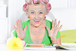 Senior woman in hair rollers