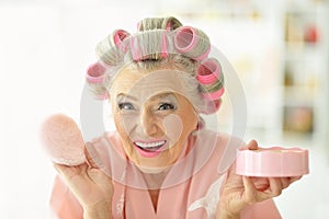 Senior woman in hair rollers