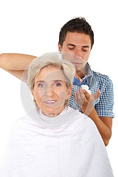 Senior woman in a hair salon with hairstylist photo