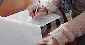 Senior woman, hands and writing on documents for will testament, retirement or life insurance on desk. Closeup of