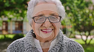 Senior woman, happy and smile of a person from Guatemala laughing with happiness outdoor. Portrait of an elderly woman