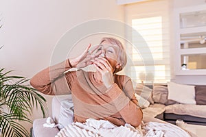 Senior Woman is having allergies and she is using nasal spray to help herself. Elder woman using nasal spray. Nasal spray to help