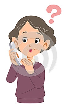 Senior woman having doubts about answering the phone