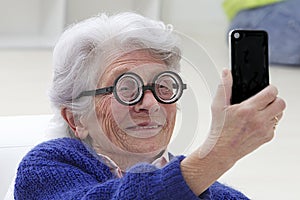 Senior woman having fun selfie herself