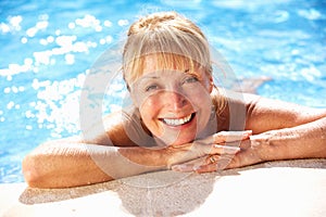 Senior Woman Having Fun In Swimming Pool