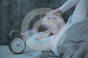 Senior woman having sleep disorder