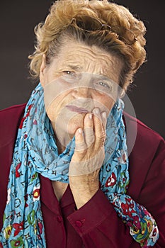 Senior woman having tooth ache