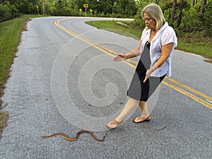 Senior Woman - Helps Snake
