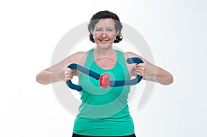 Senior woman in her 60s exercising to stay fit