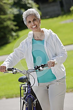 Senior woman with her bicycle