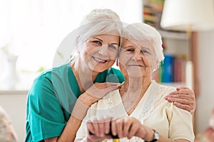 Senior woman with her female caregiver