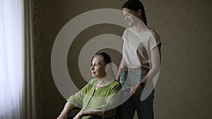 Senior woman with her home caregiver