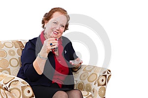 Senior Woman at her Seat Inviting to Have a Tea photo
